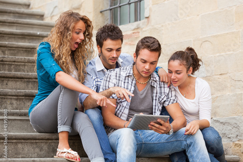 Photo: Group of Friends with Tablet PC Group of Friends with Tablet PC