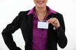 Woman displaying visitor badge