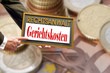 Schild mit Gerichtskosten