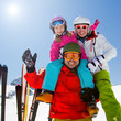 Skiing, winter fun - happy family ski team