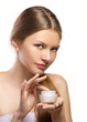 young women applying  cream