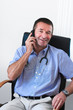 Photo: Doctor talking on mobile phone Doctor talking on mobile phone