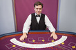 Smiling dealer with fanned out deck of cards