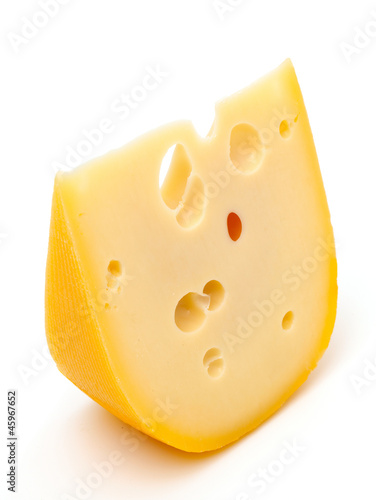 Photo: piece of cheese isolated on white background piece of cheese isolated on white background