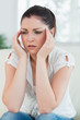 Stressed woman sitting on the couch