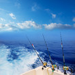 Photo: boat fishing trolling in deep blue ocean offshore boat fishing trolling in deep blue ocean offshore