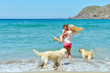 woman with child on beautiful beach