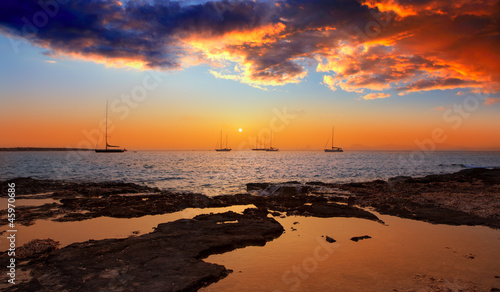Photo: colorful sunset of Ibiza view from formentera colorful sunset of Ibiza view from formentera