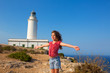 blue day with kid girl open hands to the wind