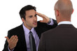 Two businessmen having a difference of opinion