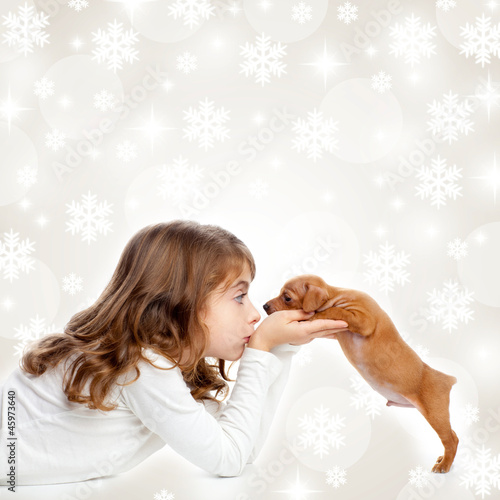 Photo: christmas children girl hug a puppy brown dog christmas children girl hug a puppy brown dog