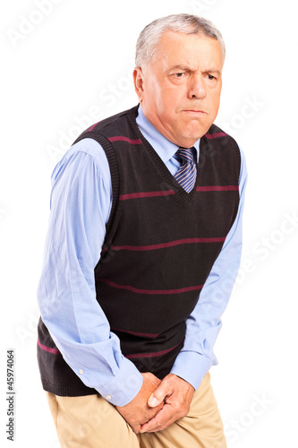 Photo: A senior man with bladder control problem A senior man with bladder control problem