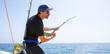 blue sea offshore fishing boat with fisherman