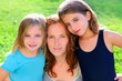 mother and two sister daughters in the garden