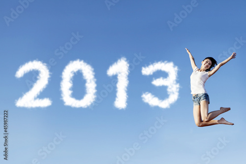 Photo: Woman jump welcoming new year 2013 Woman jump welcoming new year 2013