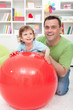Foto: Fun with dad - little boy playing with his father Fun with dad - little boy playing with his father