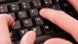 Very fast writing on a modern black keyboard