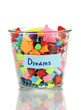 Photo: Glass vase with paper stars with dreams isolated on white Glass vase with paper stars with dreams isolated on white