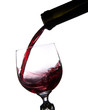 Pouring wine into glass isolated on white