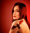 Girl with bat tatoo