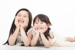 Photo: happy two asian girls on the white background happy two asian girls on the white background