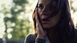Sad, depressed young woman in the city, slow motion