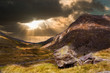Moody dramatic mountain sunset landscape