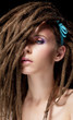 Dreadlocks. Fashion hairstyle with dreads - beauty woman face