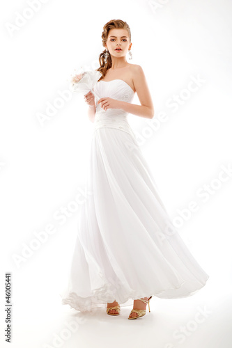 Photo: Portrait of beautiful bride. Wedding dress. Bouquet of flowers Portrait of beautiful bride. Wedding dress. Bouquet of flowers