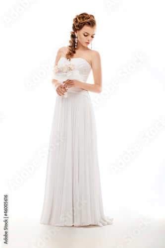 Photo: Beauty newlywed woman with wedding bouquet of flowers Beauty newlywed woman with wedding bouquet of flowers