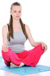 Foto: young and cute woman meditate on a blue mat isolated young and cute woman meditate on a blue mat isolated