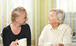 Senior woman with her granddaughter talk to each other.