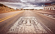 Photo: An old Route 66 shield painted on road An old Route 66 shield painted on road