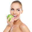 Smiling beauty holding green apple