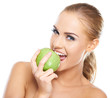 Beautiful  young woman bites a green apple