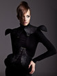 Fashion portrait of pretty girl on a dark background