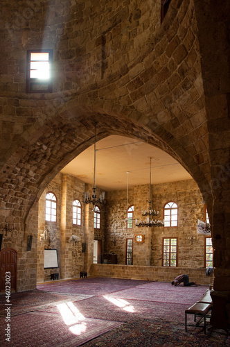 Photo: Praying in an old mosque in Sidon, Lebanon Praying in an old mosque in Sidon, Lebanon