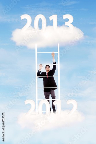 Photo: Businessman try to gain his success on 2013 Businessman try to gain his success on 2013