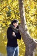 Beautiful woman in autumn forrest