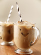Photo: Iced coffee with black striped paper straw Iced coffee with black striped paper straw