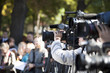 Foto: covering an event with a video camera covering an event with a video camera