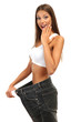 beautiful young woman with big jeans, isolated on white