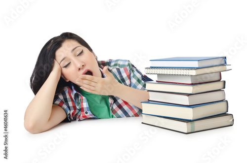 Photo: Tired student with textbooks on white Tired student with textbooks on white