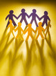Paper people in teamworking concept