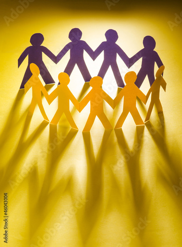 Photo: Paper people in teamworking concept Paper people in teamworking concept