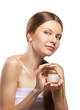beautiful  women applying cosmetic cream