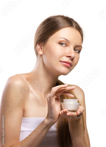 Photo: beautiful women applying cosmetic cream beautiful women applying cosmetic cream