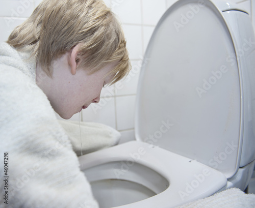 Photo: Young boy with stomach flu vomiting Young boy with stomach flu vomiting