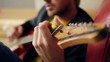 Guitarists hands playing song  on electric guitar