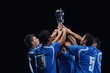 soccer players celebrating victory